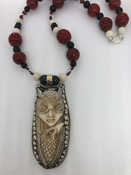 Carved Goddess with Bird